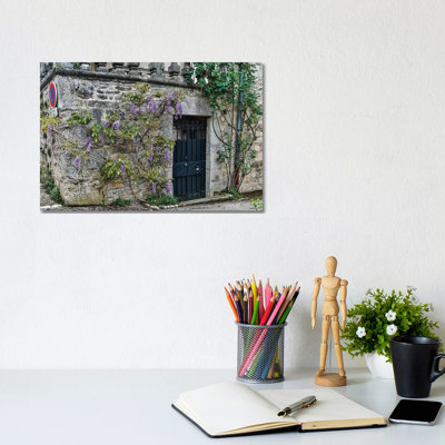 Wisteria Covered Stone Wall And Doorway, Cajarc, France by Hollice Looney - Wrapped Canvas Print