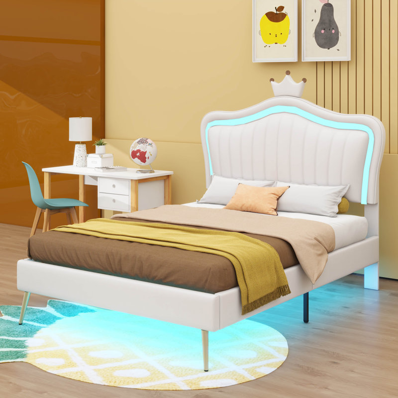 Structure de lit simple tapissier avec lumières à DEL intégrées et une élégante tête de lit en forme de couronne pour un design de princesse moderne