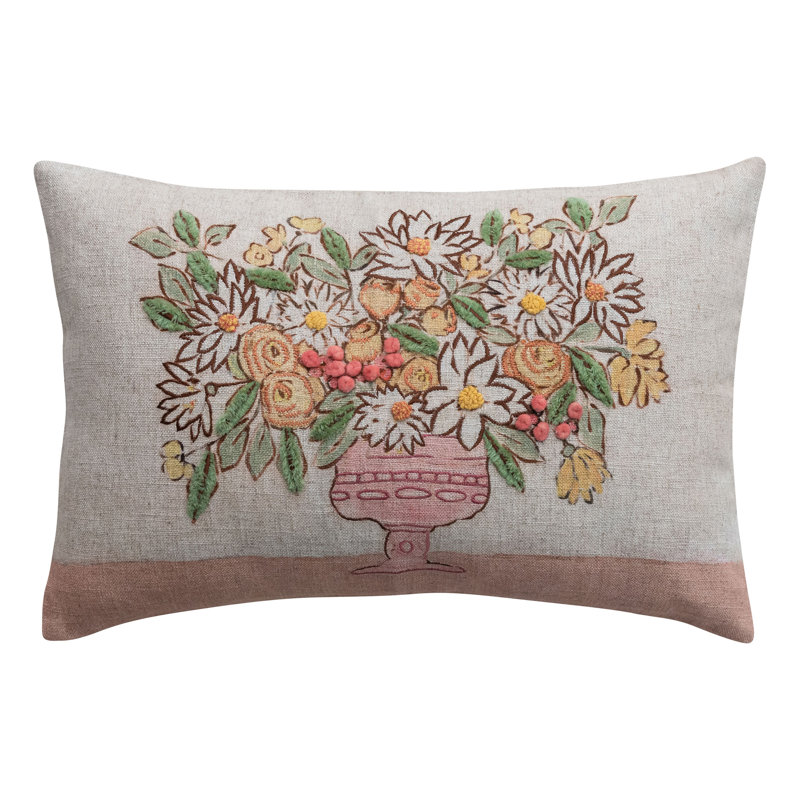Coussin lombaire brodé en lin avec fleurs et pompons