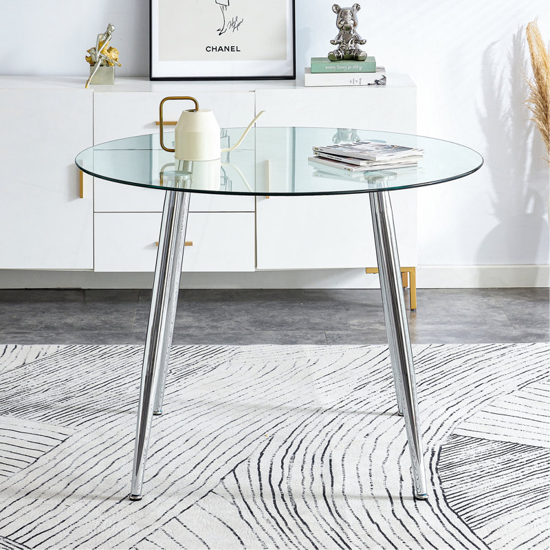 Un plateau de table en verre d'un diamètre de 38,6 pouces et une table de salle à manger circulaire minimaliste moderne avec des pieds en métal argenté. Convient pour les salons et les salles de conférence.