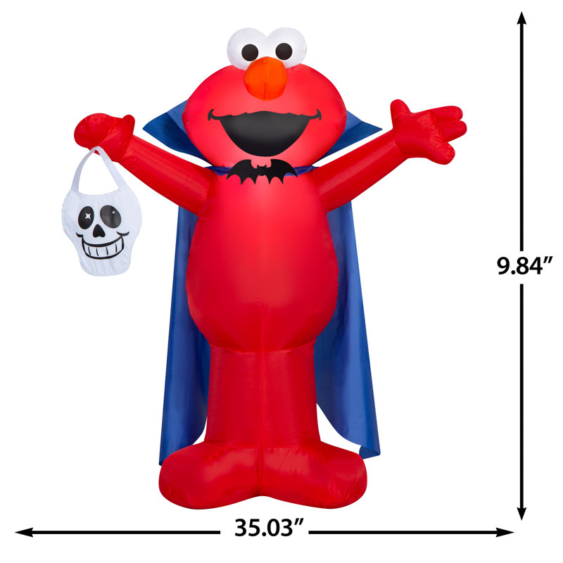 Elmo soufflé à l'air comme vampire avec crâne Sesame Street