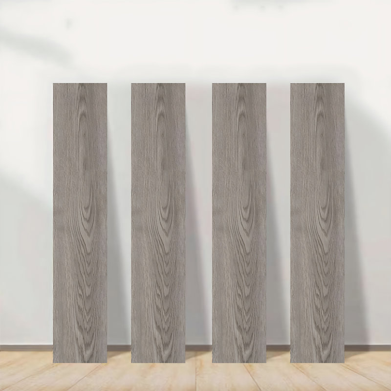 Self-adhesive vinyl floor tiles. Easy peel-and-stick installation allows one person to complete DIY flooring projects. Wood-grain self-adhesive floor tiles, 36 inches × 6 inches, 54 tiles per package (covers 81 Sq.Ft). Ideal for indoor home renovations.