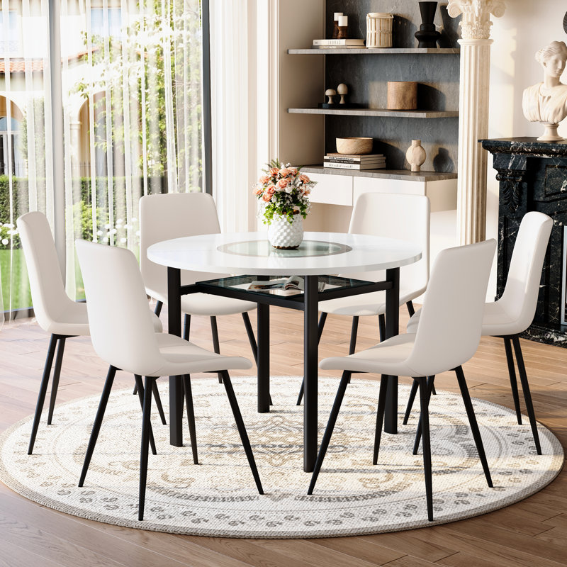 Ensemble de table de salle à manger moderne blanc avec coussins incurvés, verre et métal