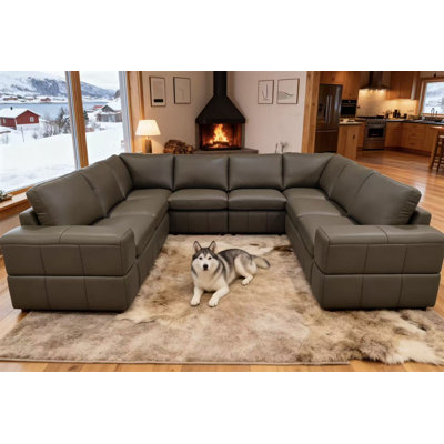Canapé modulaire à large accoudoirs en cuir assorti