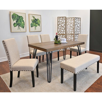 Ensemble de salle à manger six pièces avec table à manger en épingle à cheveux et quatre chaises confortables, parfait pour les salles à manger modernes et les réunions de famille.