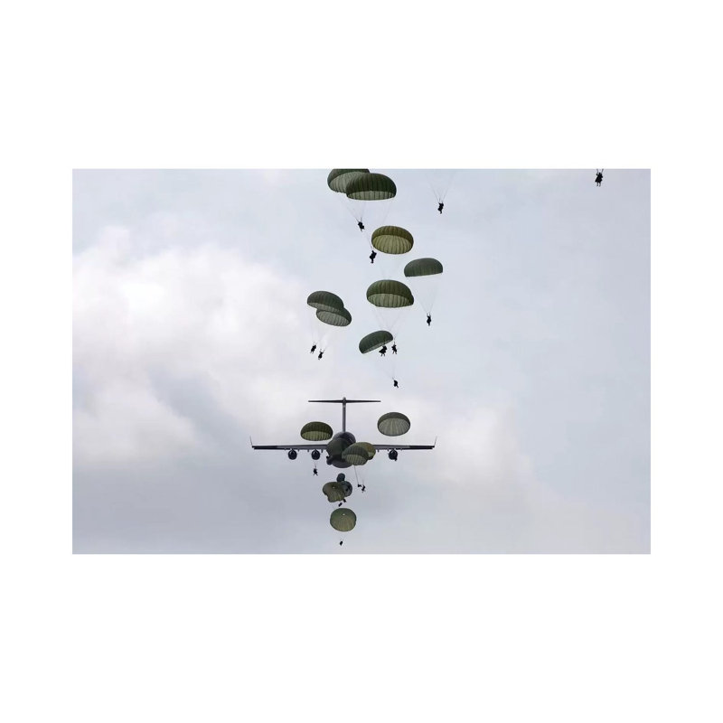 Army Soldiers Jump Out Of A C-17 Globemaster III by Stocktrek Images - Wrapped Canvas Print