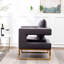 Fauteuil gris contemporain - Style avec assise rembourrée, structure en métal, dossier carré, accoudoirs confortables et revêtement en tissu doux effet velours, pour une détente optimale.