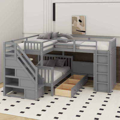 Lit simple superposé au dessus d'un lit double avec tiroirs, bureau et garde-robe