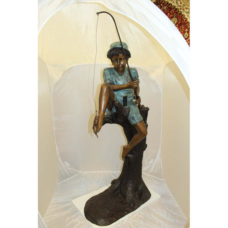 Boy Sitting on a Tree and Fishing Bronze Statue -  Size: 34"L x 28"W x 64"H. 