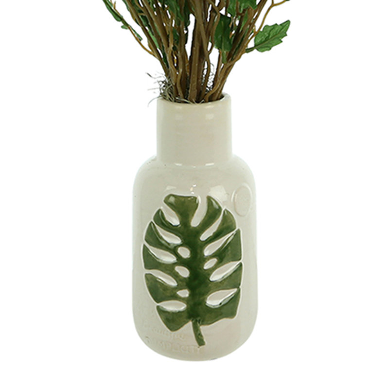 Organic Modern Smilax Arranged In A Ceramic Leaf Vase