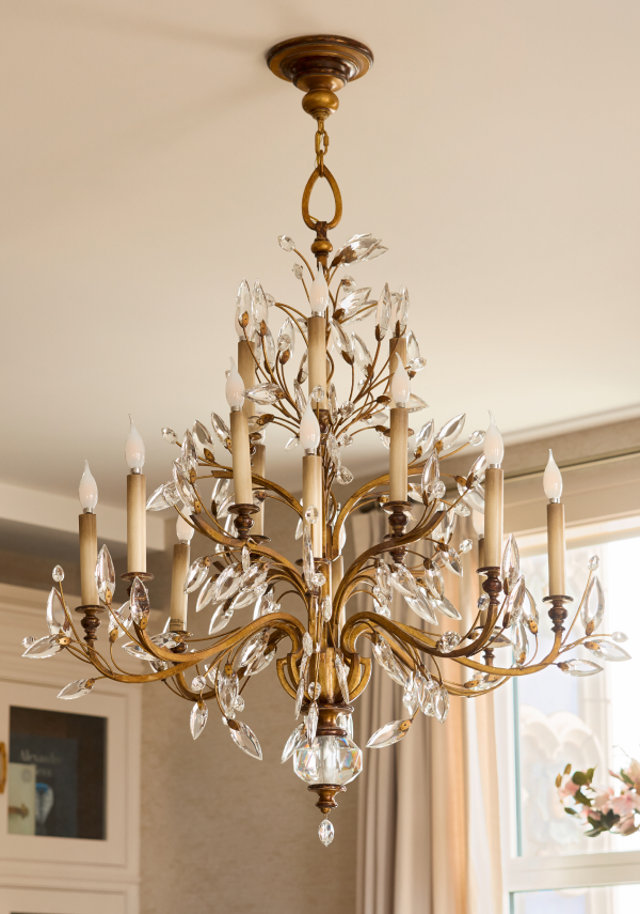 Gold candelabra chandelier with crystal accents.