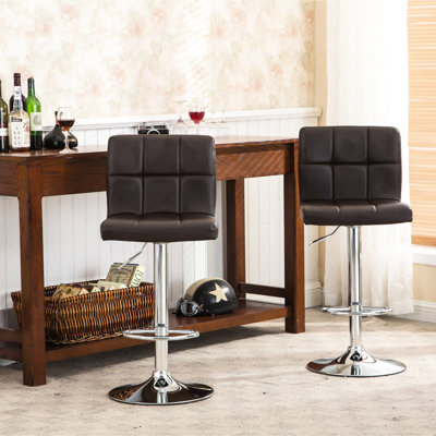 Adjustable Brown Hydraulic Bar Stools Of 2. Faux Leather Seat And Strong Construction. 360 Degree Swivel Footrest. Foam-injected For Comfort. 17.5w X 17.5d 35 - 43.5h Inches 2 Stools. With Foam