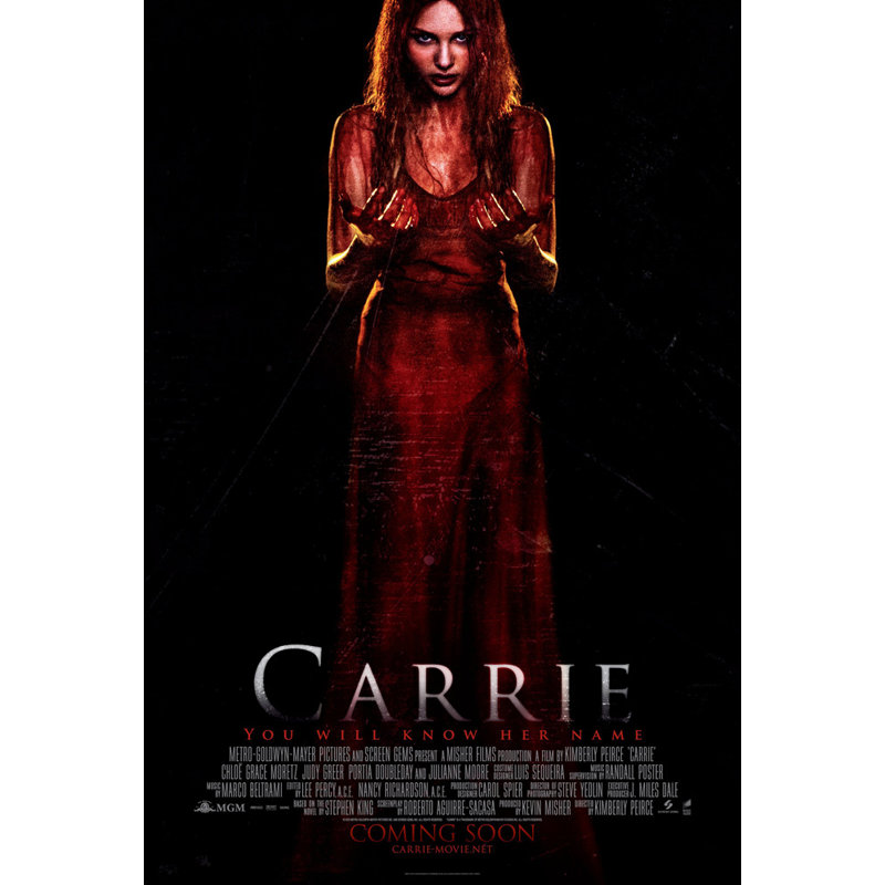 Carrie, H 24 po x l 16 po