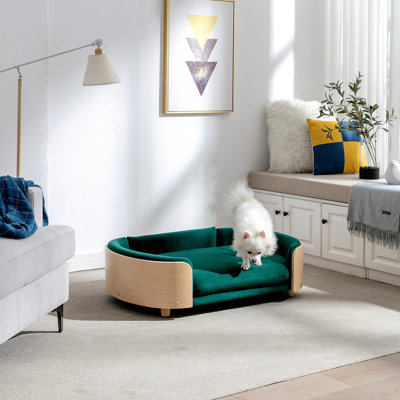 Lit pour chien surélevé de style scandinave avec pattes en bois massif et dossier en bois courbé, coussin en velours