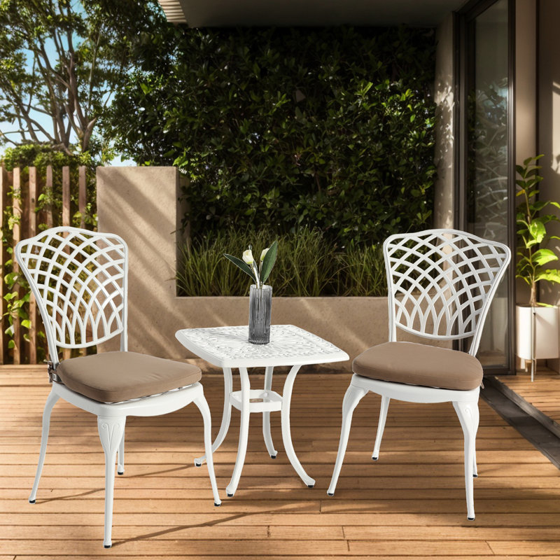 Ensemble bistro 3 pièces en fonte d'aluminium - 2 chaises et 1 table ronde avec coussin en blanc pour une utilisation extérieure