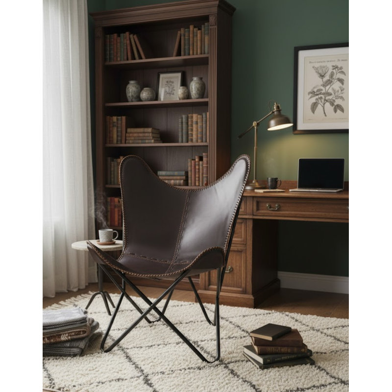 Fauteuil papillon en cuir brun foncé