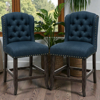 Ensemble de 2 chaises à hauteur de comptoir capitonnées en tissu bleu marine / brun foncé Lela