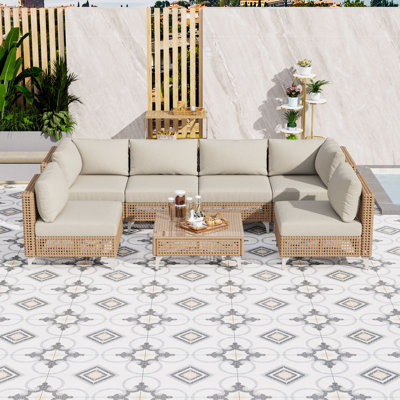 Ensemble modulaire d'extérieur en osier 7 pièces avec table basse en verre trempé et conversation modulaire avec coussins