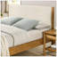 Luxueux lit plateforme en bois d'hévéa avec tête de lit en velours côtelé beige et lattes durables, parfait pour les chambres élégantes