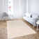 Niquan Abstract Ivory Hand-Hooked Area Rug