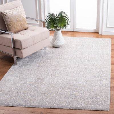 Tapis beige à motif floral Bardella
