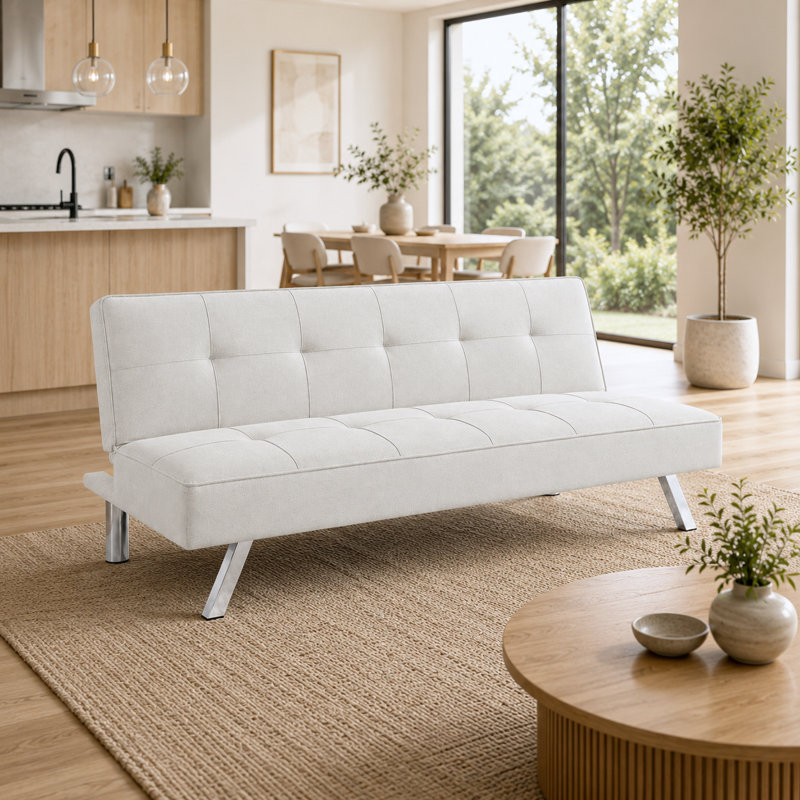Le canapé pliant en tissu multifonctionnel beige du salon peut être transformé de manière flexible en un lit, ce qui en fait un meuble à double usage pour les petites maisons