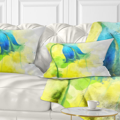 Coussin à imprimé floral bleu avec éclaboussures jaunes