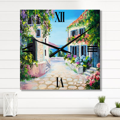Horloge murale maisons avec fleurs en fleurs près de la mer