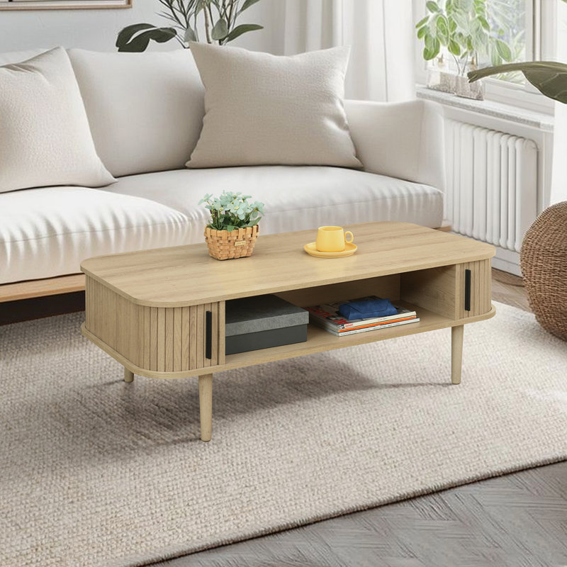 Aguilera 47.2" W Mid Century Coffee Table with Storage and Fluted Sliding Door, Oak