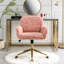 Fauteuil de bureau à assise large rose, piètement en métal doré, pour un environnement d'étude productif et respirant.
