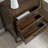 Kaveah Solid + Manufactured Wood Rustic Wood Side Table with AC/USB in Distressed Riverstone
