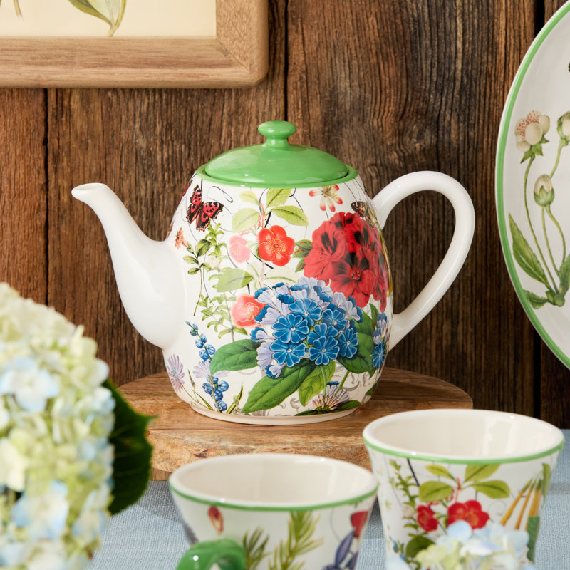 Green and White Ceramic Floral Teapot with Butterfly Accents