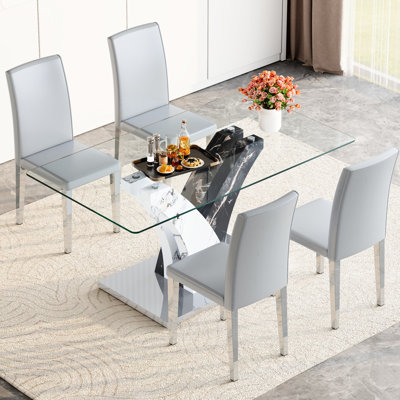 Elegant Dining : Clear Glass Table, Artistic Legs, And 4 Gray Pu Chairs With Stable Structure Soft Feel Simple Yet Stylish Transparent Leather For Entertaining Guests