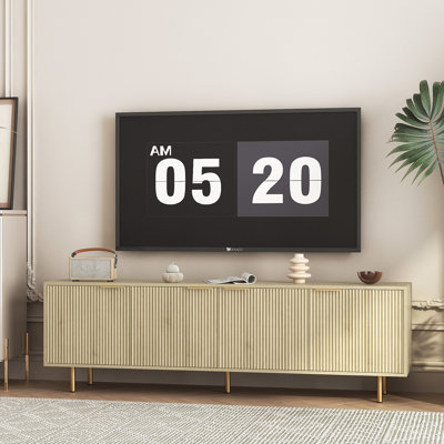 Meuble télé moderne avec portes cannelées et pieds dorés