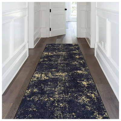 Tapis lavable MAVAL, tapis noir et doré à motif abstrait patiné