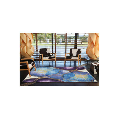 Tapis décoratif moderne mauve à motif prismatique abstrait
