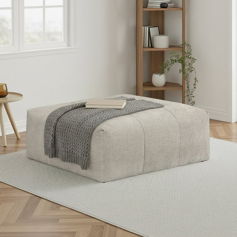 Repose-pieds moderne et contemporain de 46 po avec revêtement en tissu texturé, détails capitonnés élégants et roulettes faciles à déplacer Louise