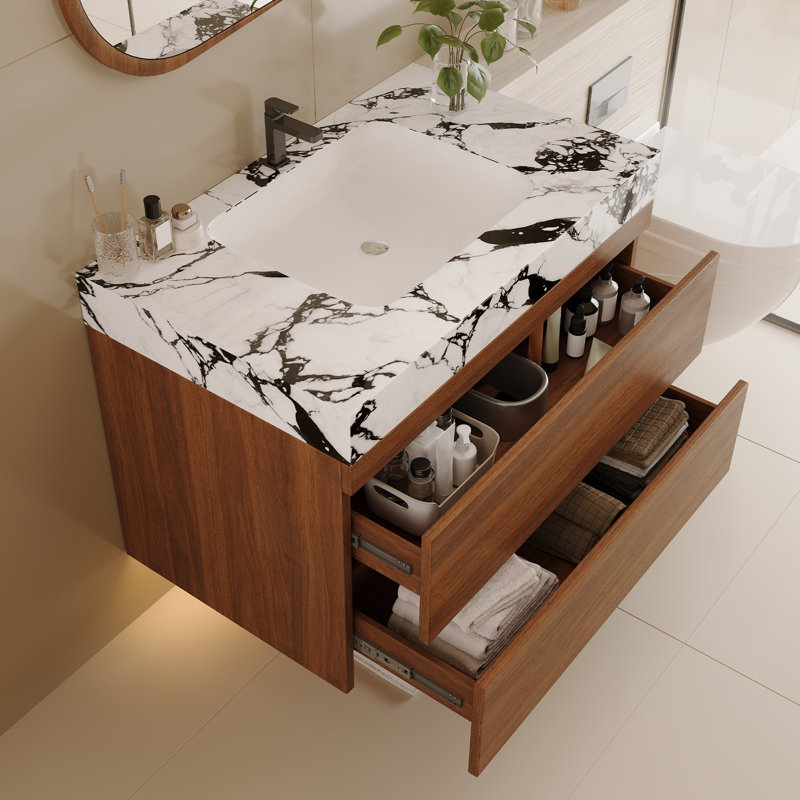 Meuble-lavabo moderne peu encombrant avec lavabo en céramique et comptoir en faux marbre, parfait pour les petites salles de bain