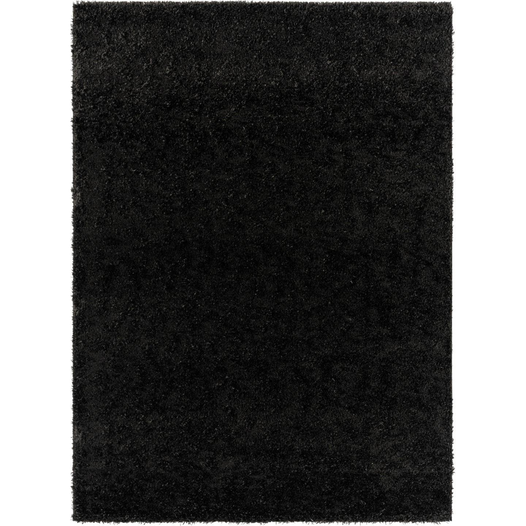 Solid Color Machine Woven Polypropylene Area Rug in Black Luxe Weavers Rug 