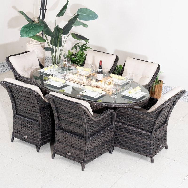 Omied 6 - Person Wicker Patio Dining Set With Oval Table , Cushions Included