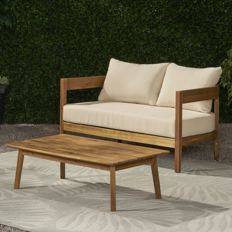 Table basse en bois pour l'extérieur et table basse avec coussins d'eau