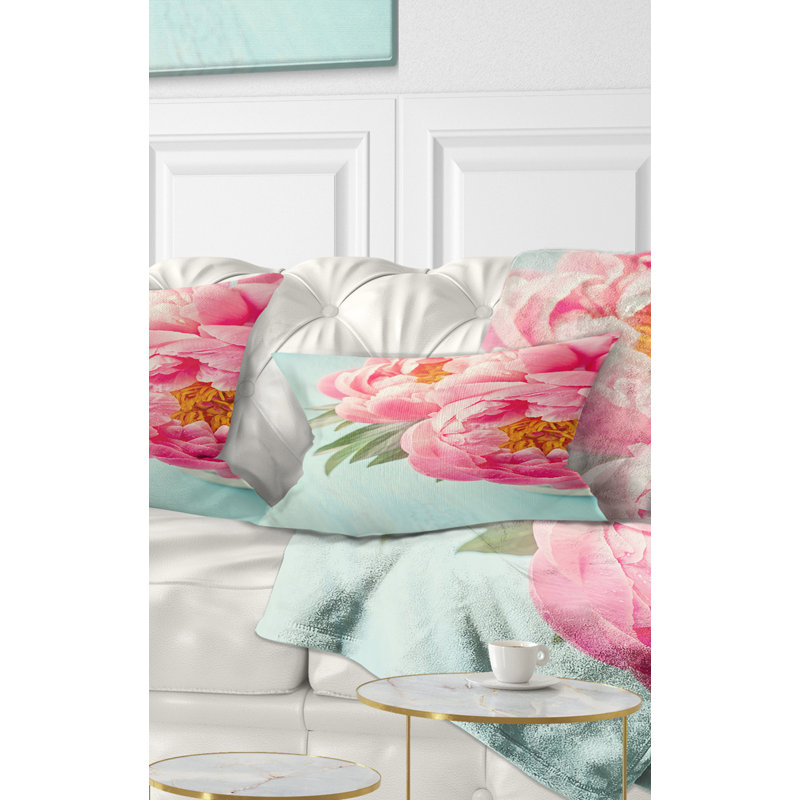 Coussin lombaire floral sur fond pivoine
