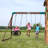 Backyard Discovery Highlander Cedar Wood Swing Set with Wave Slide, Three-Story Clubhouse, Rock Wall, and Picnic Table