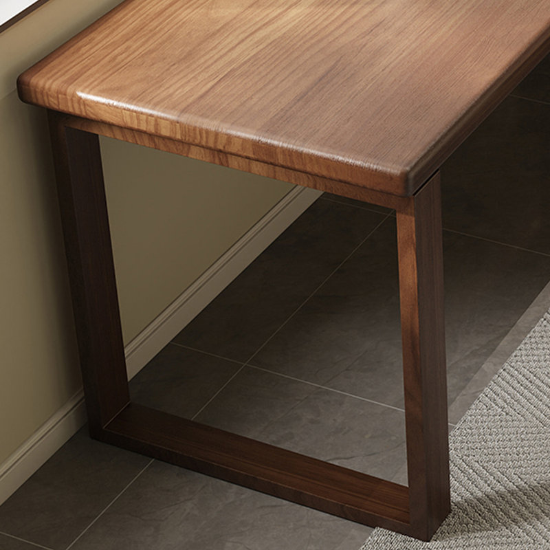 A simple rectangular solid wood desk in walnut color, 29.53" H x 62.99" W x 23.62" D