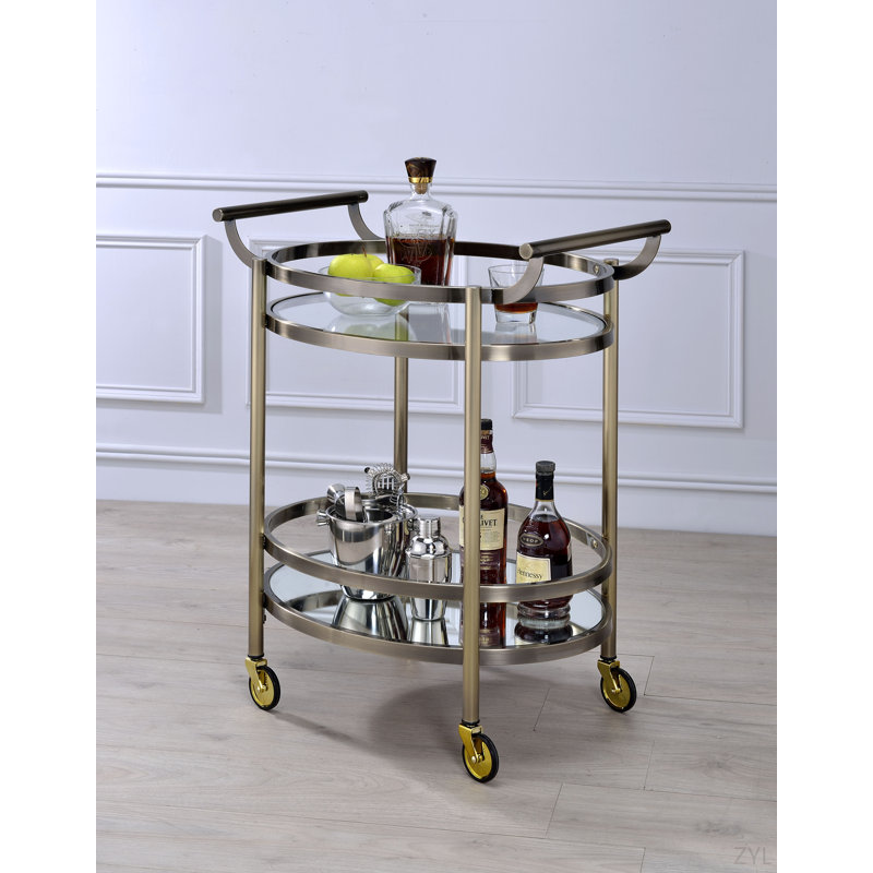 Chariot de service en verre transparent et finition bronze brossé