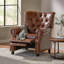 Fauteuil inclinable contemporain avec dossier capitonné et garniture cloutée