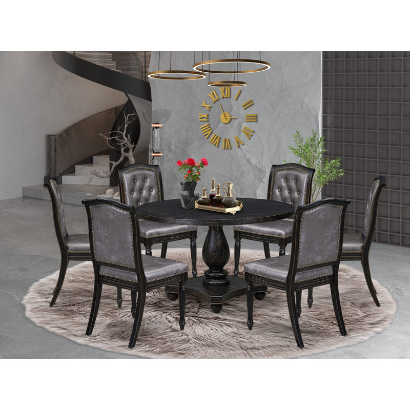 L'ensemble de salle à manger 7 pièces comprend une table ronde de style Mid-Century et 6 chaises en polyester gris foncé avec dossier haut, finition noire sablée.