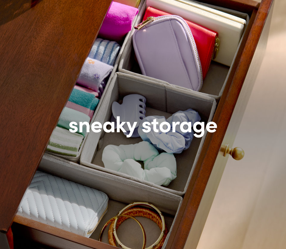 Organized drawer storage with colorful supplies and compartment dividers.