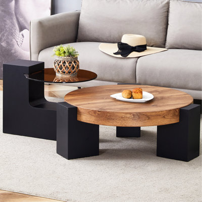 Table basse ronde moderne simple à double couche - Plateau en verre brun transparent avec pieds en panneau de fibres à densité moyenne noirs en forme de L. La conception détachable peut rendre l'utilisation de l'espace plus flexible. W1151P209571