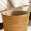 Poubelle de salle de bain en rotin naturel tissé - sans couvercle, style minimaliste. Rangement de salle de bain alliant esthétique et fonctionnalité.